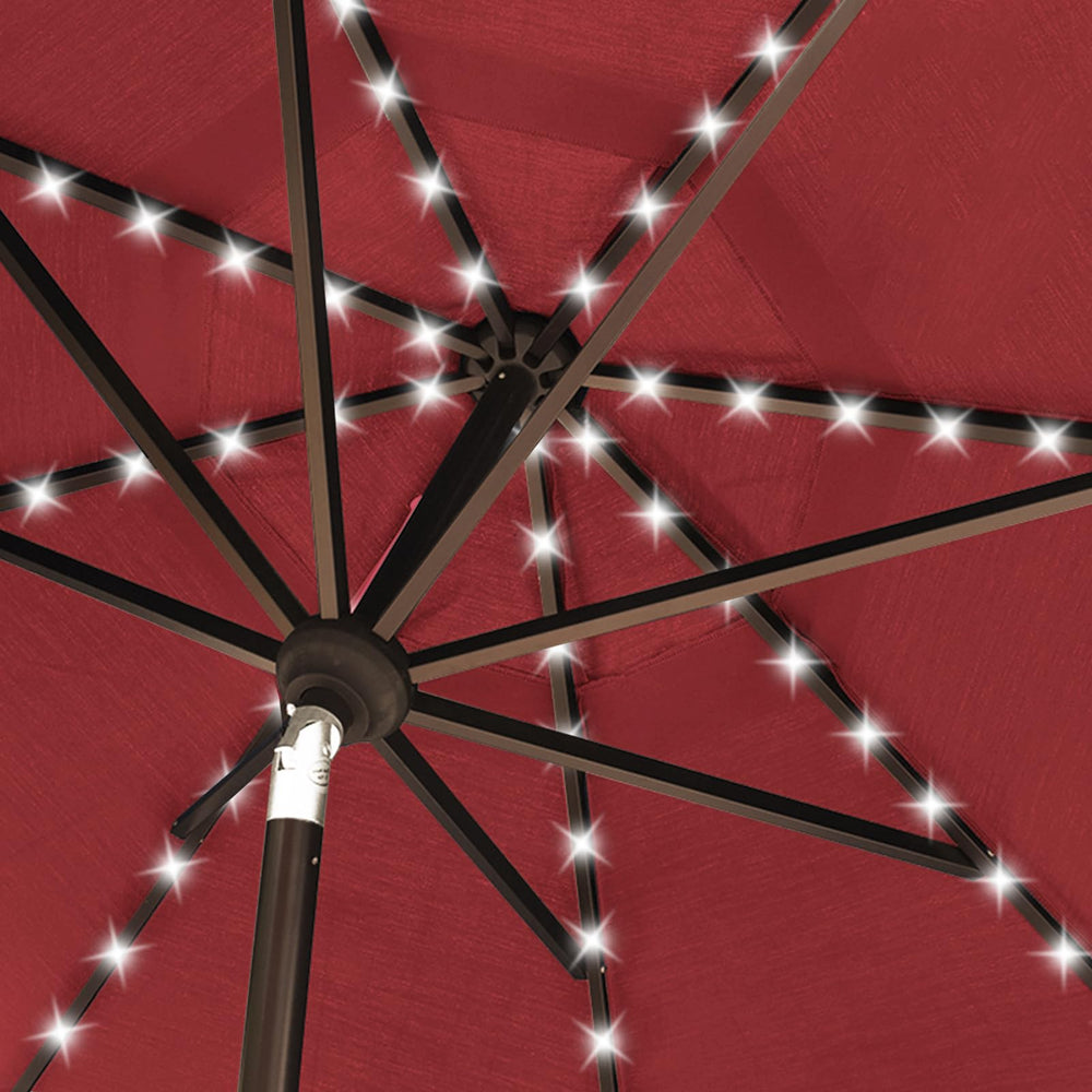 EliteShade umbrella installed over dining table showing correct scale and base compatibility