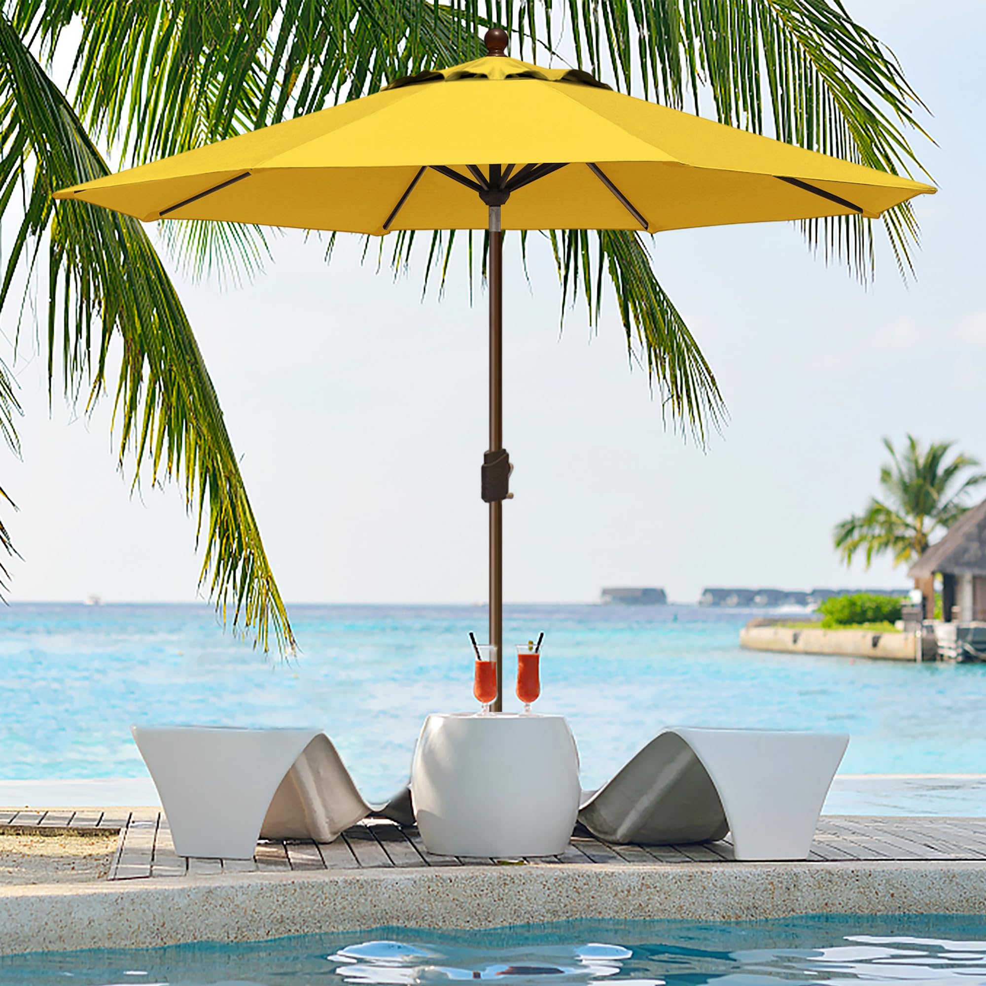 EliteShade umbrella beside chair showing 9ft scale and proper fit benefit