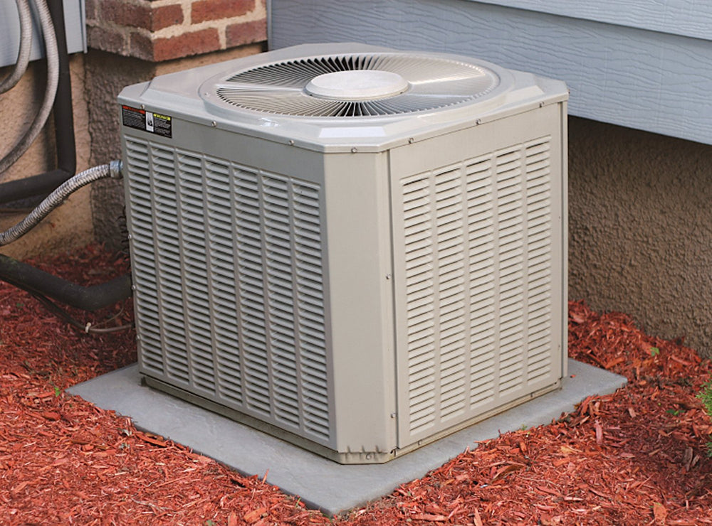 Emsco Group pad placed under air conditioner demonstrating level support benefit