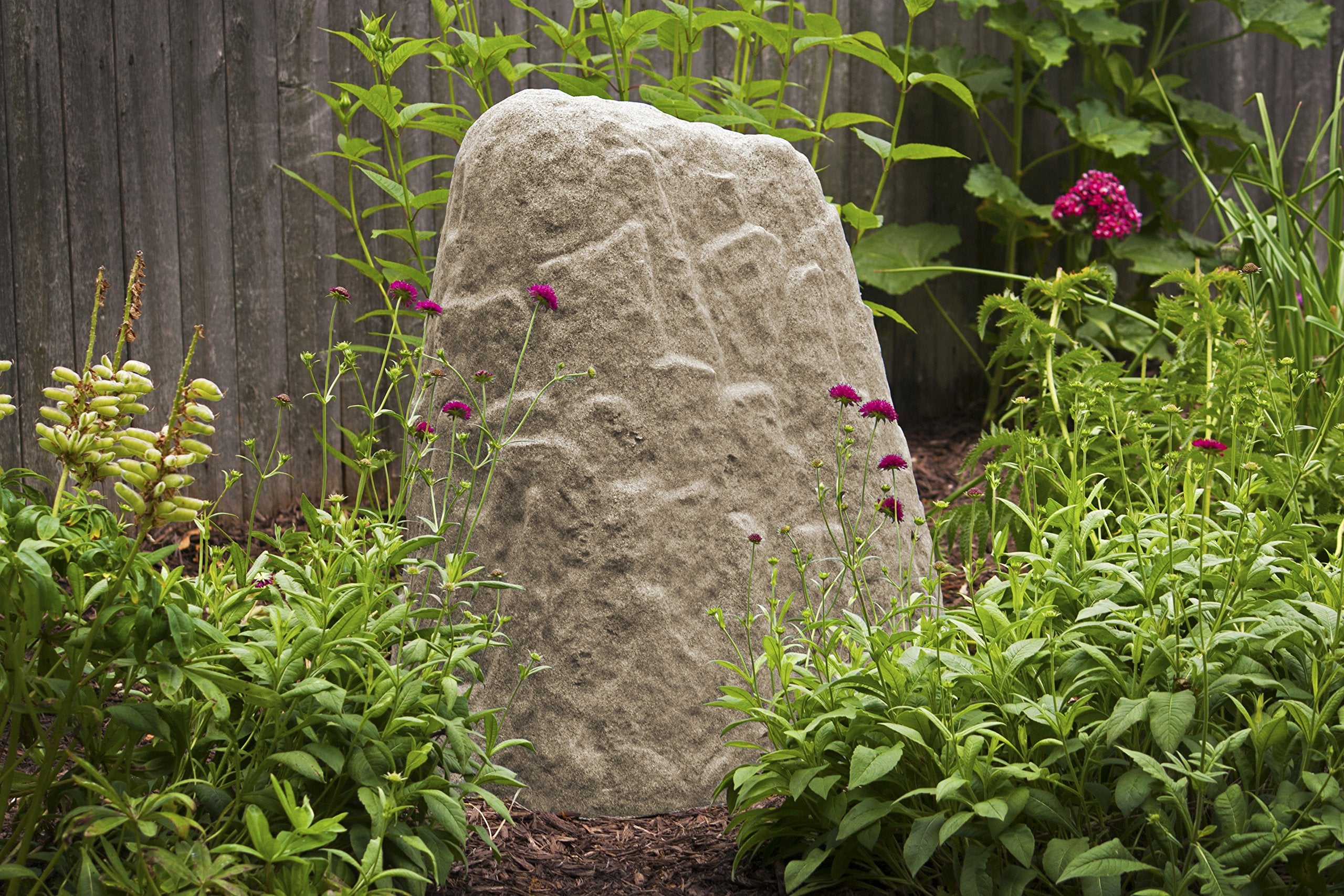 Emsco sandstone scale next to foot demonstrating lightweight lift-and-place benefit