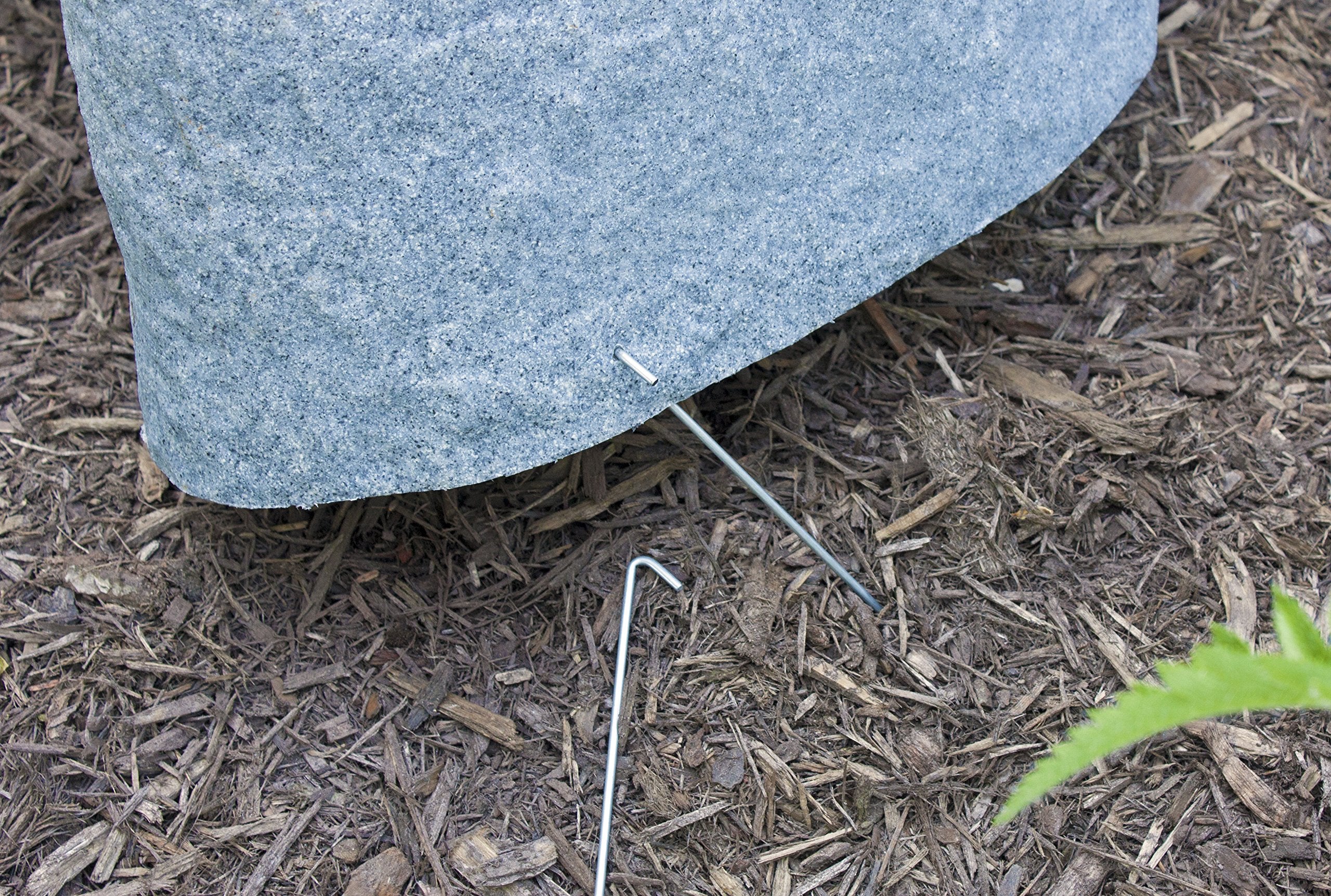 Emsco Group rock next to hand showing compact size and effortless one-person placement