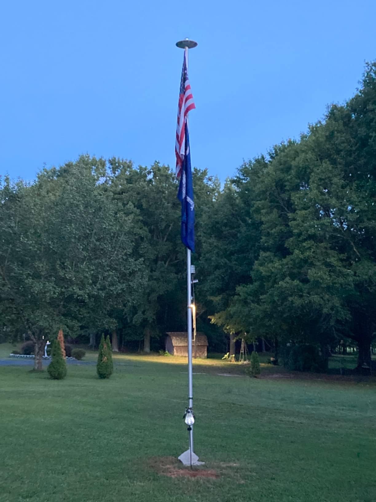 enrybia nighttime shot illuminating a large flag for clear visibility after dark