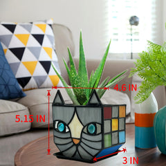 Entlityful planter on a sunny windowsill with succulent, highlights light-catching color and compact size