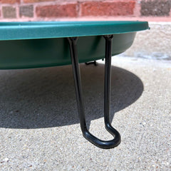 Erva bird bath placed in garden near shrubs with visiting birds, encourages wildlife visits
