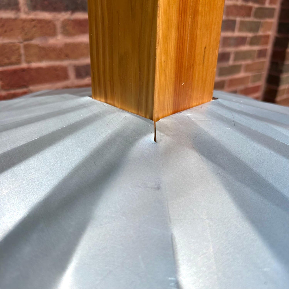 Erva baffle beside tape measure showing diameter for correct sizing
