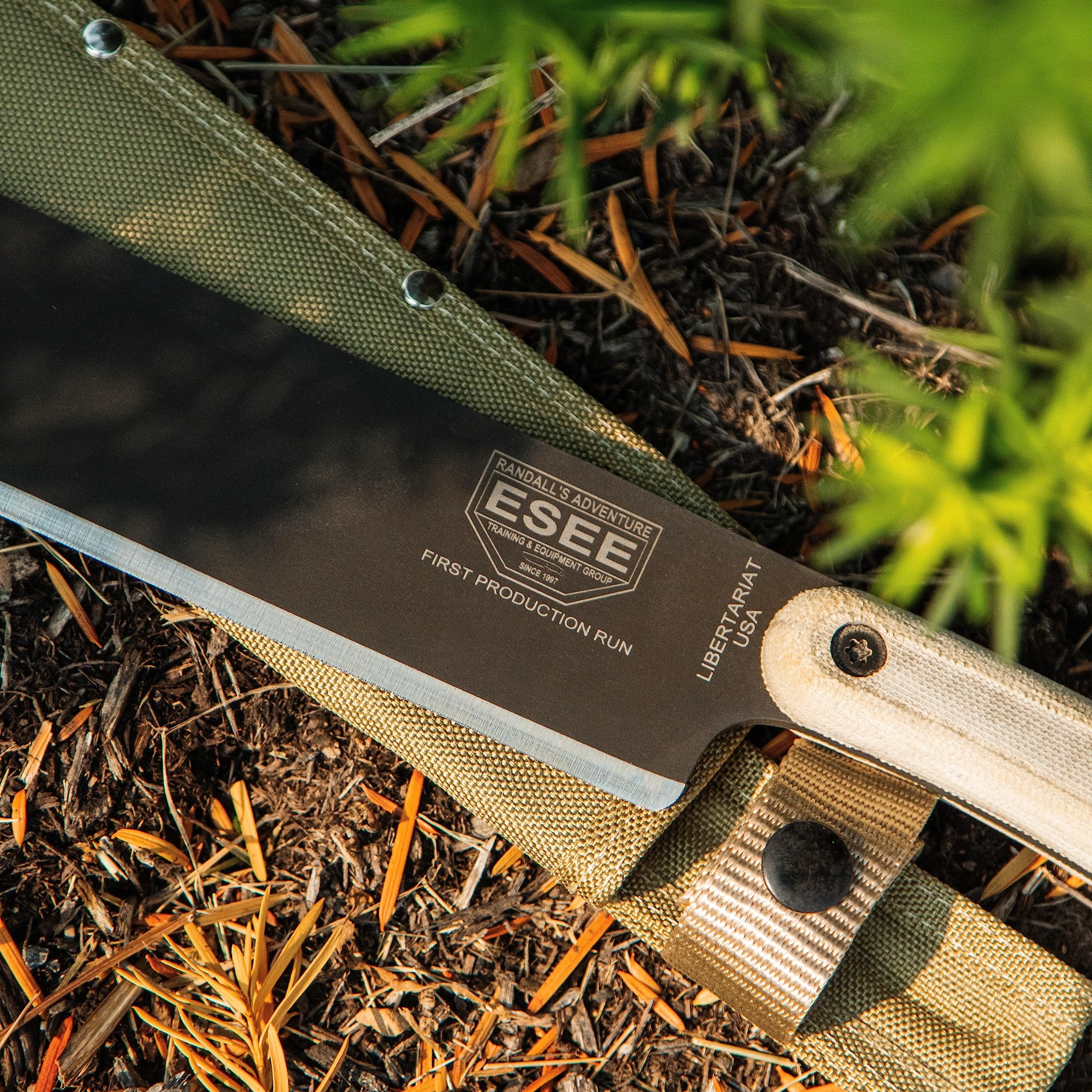 ESEE Libertariat chopping wood in field demonstrating chopping power and control