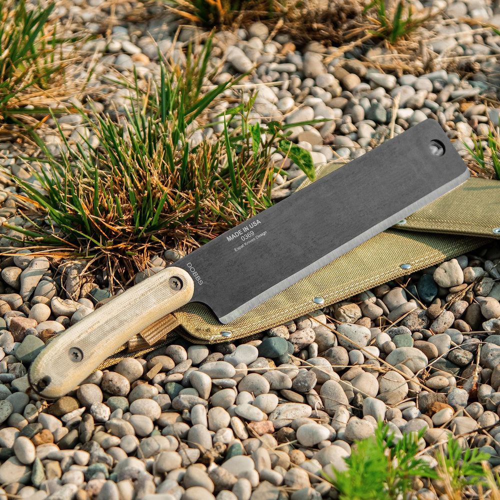 ESEE Libertariat held in hand for scale showing compact, portable design