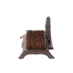 Esschert Design boot brush on a porch with a shoe being cleaned, keeping floors tidy