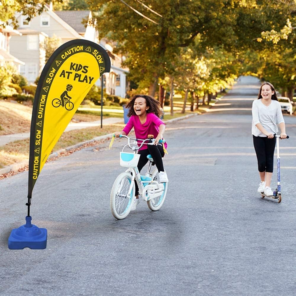 Essentially Yours flag beside child's bicycle showing scale and clear sightline benefit