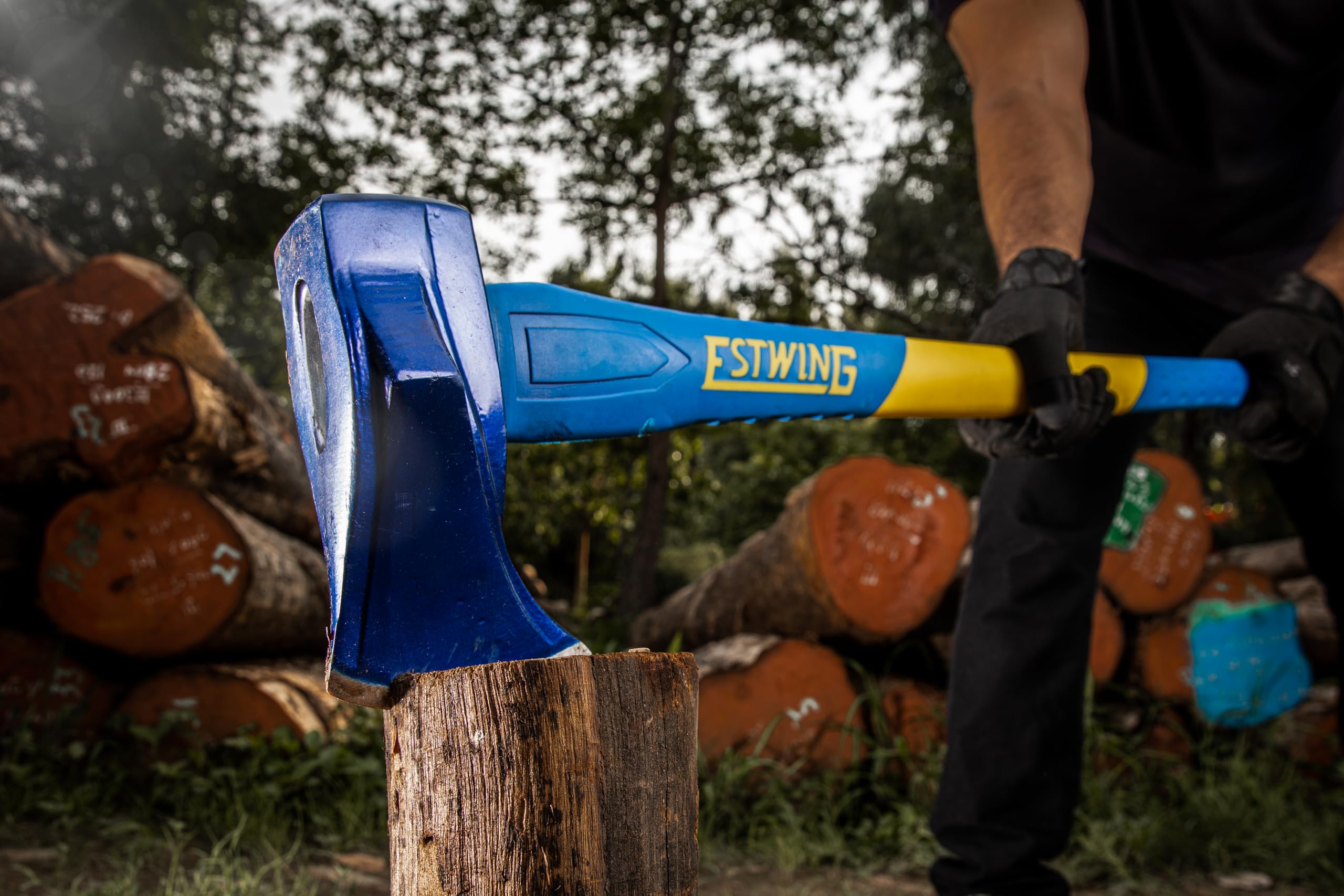 Estwing axe next to measuring tape showing 36-inch scale and leverage