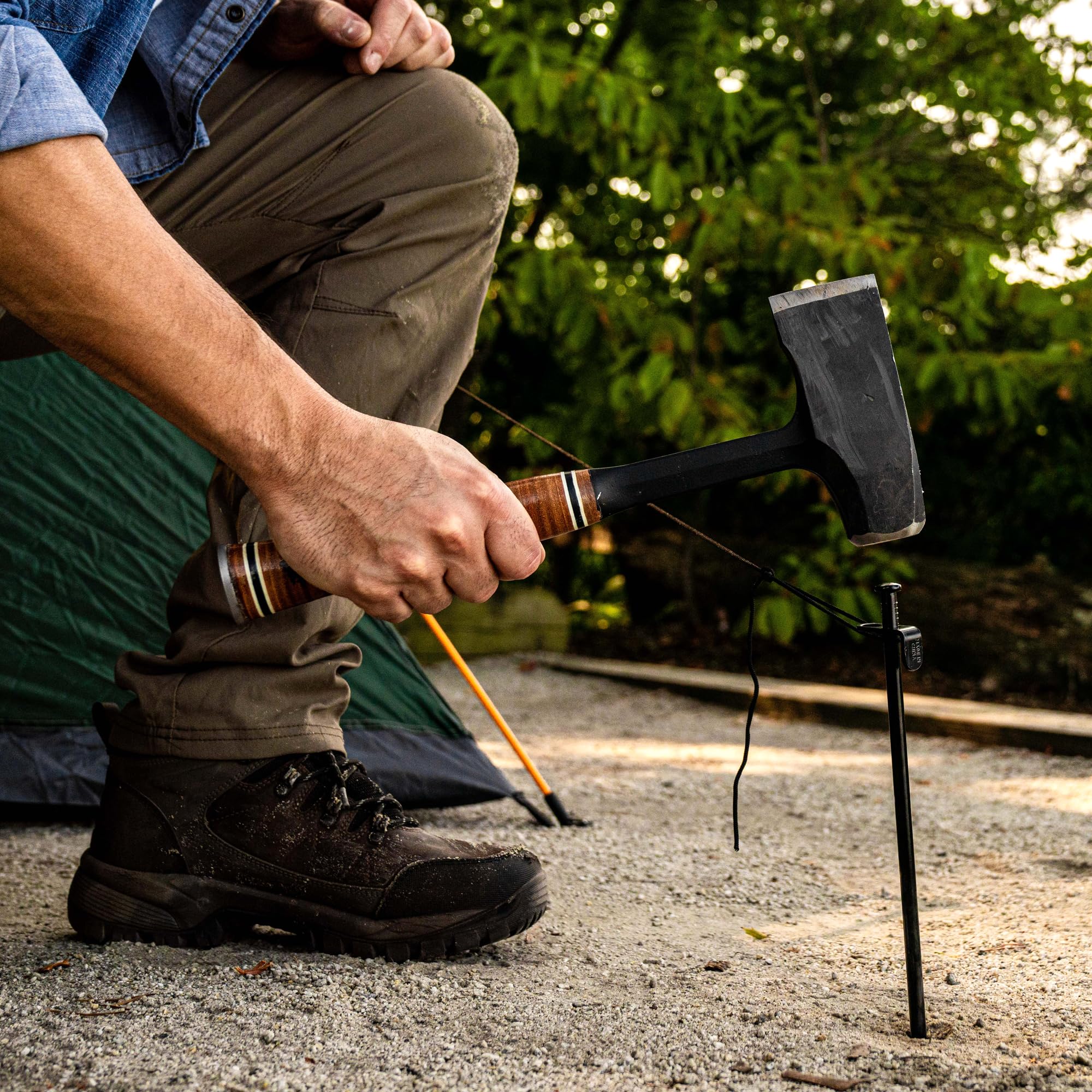 Estwing maul next to water bottle showing compact size and portable benefit for campers