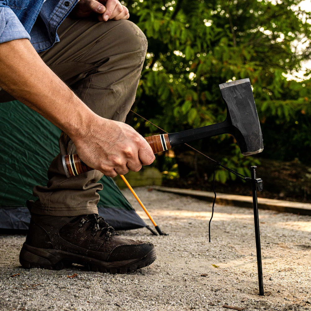 Estwing maul next to water bottle showing compact size and portable benefit for campers
