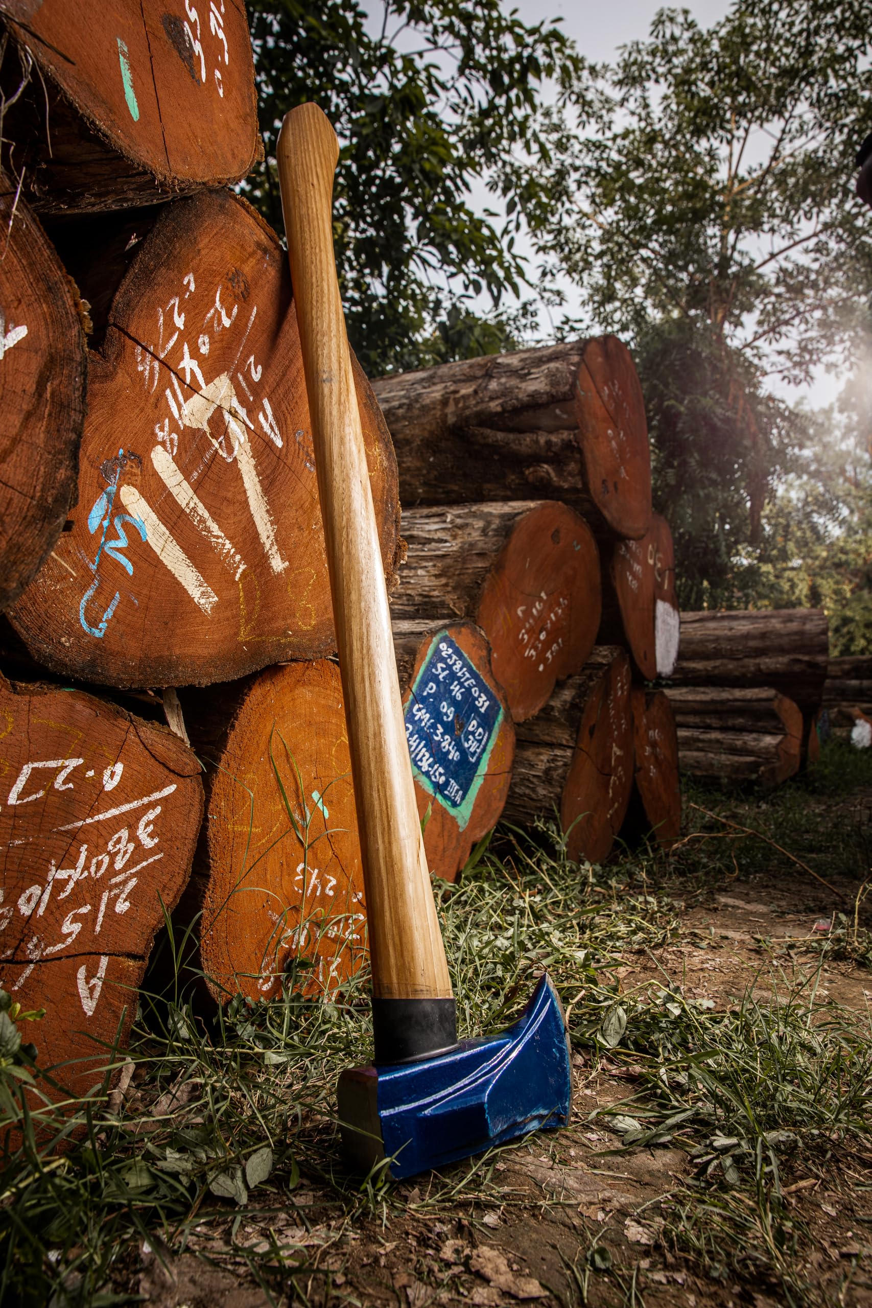 Estwing maul leaning in woodshed showing practical yard-ready durability