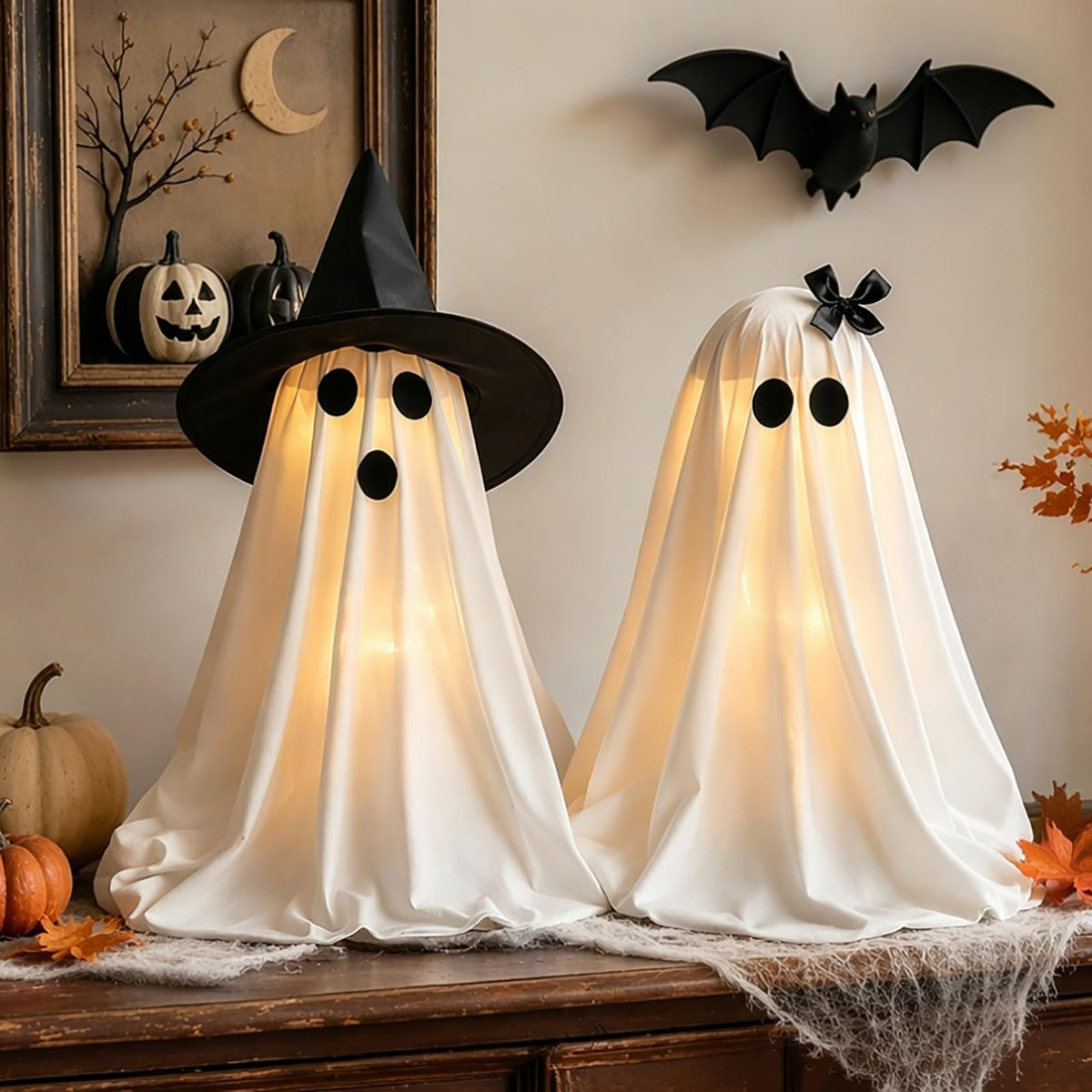 Eucehlre front view of light-up ghosts on mantel showing cozy ambiance