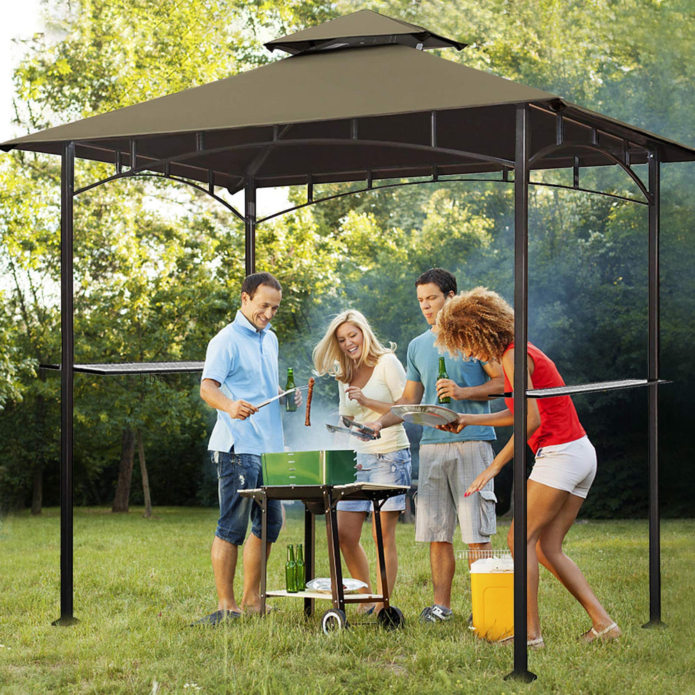Eurmax lifestyle backyard grill setup showcasing canopy protecting cooking area