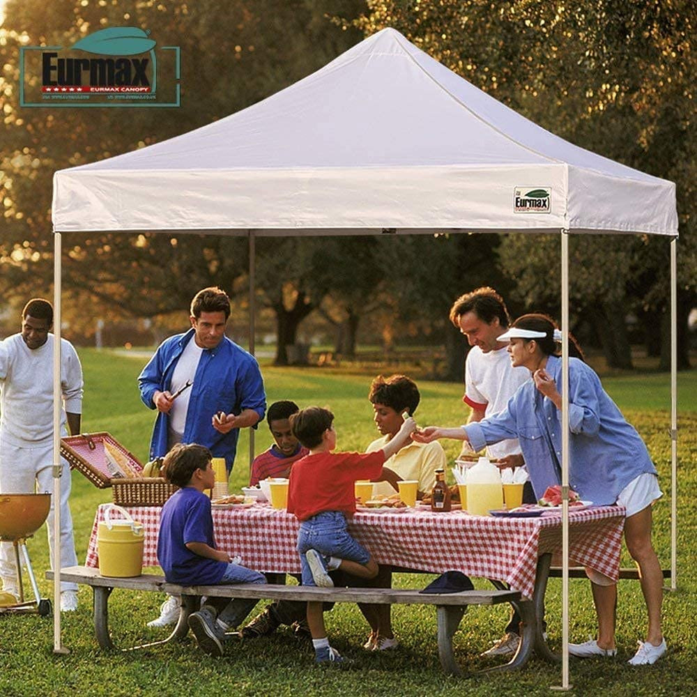 Eurmax canopy scale comparison next to people showing fit on a standard 10x20 frame