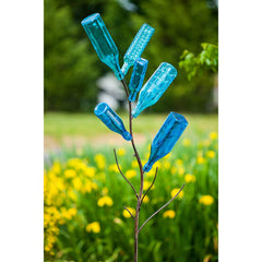 Evergreen Family Products bottle tree with colored bottles catching sunlight for brightness
