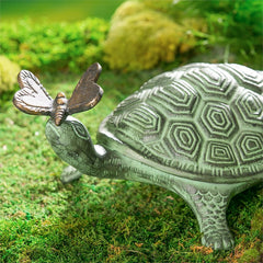 Evergreen Garden close-up of turtle shell and butterfly highlighting hand-carved detail