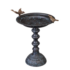 Evergreen Garden front view showing ornate cast iron bird bath and stand, durable focal point