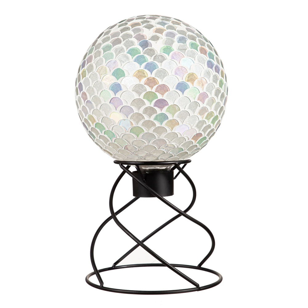 Evergreen Garden stand holding a gazing ball in a flower bed adding reflective focal point