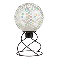 Evergreen Garden stand holding a gazing ball in a flower bed adding reflective focal point