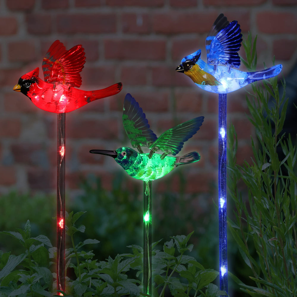 Exhart front view of three bird stakes showing colorful accents and LED glow