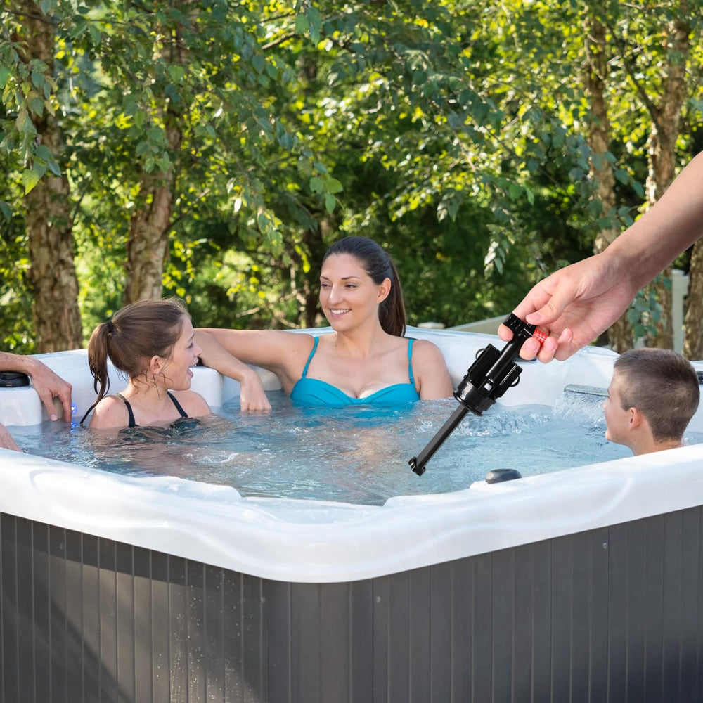 Outdoor hot tub with Exquimac box nearby illustrating simple maintenance
