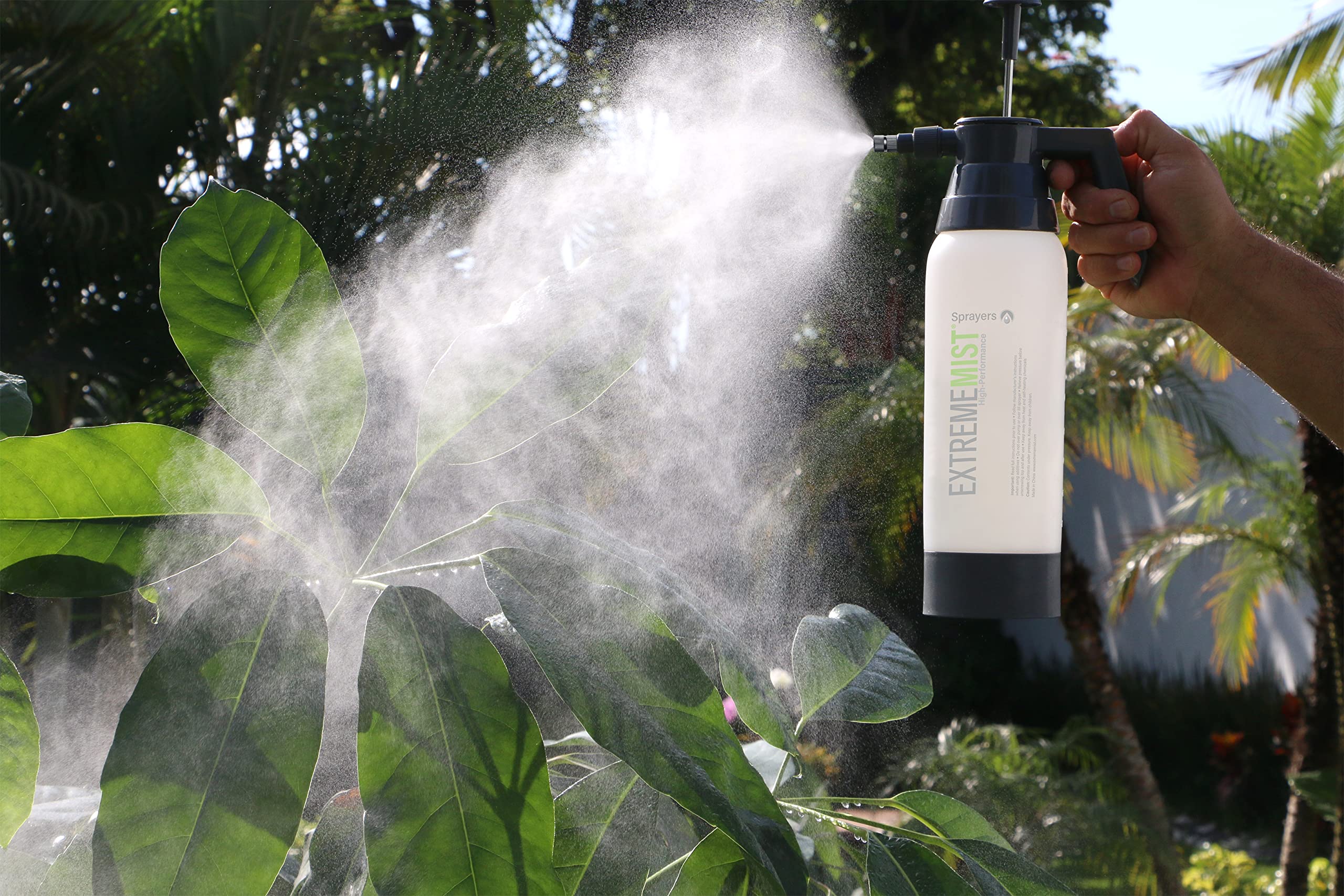 ExtremeMIST on a plant shelf in a home setting for stylish, reliable misting