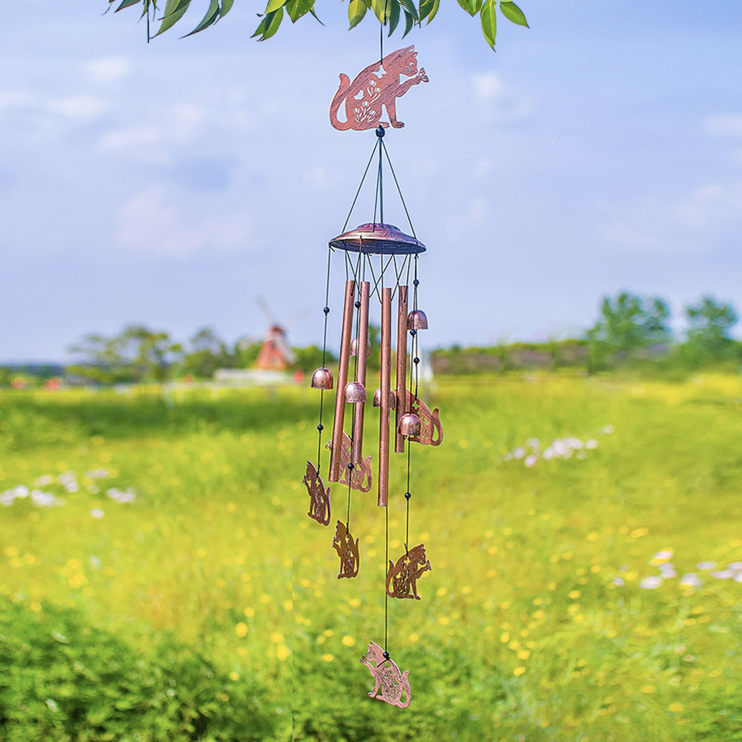 EZTZEN wind chime suspended from a tree adding movement to garden scenes