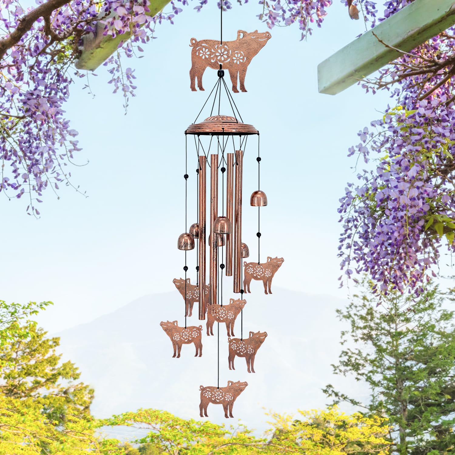 EZTZEN pig wind chime in a garden setting adding whimsical decor and soothing melodies outdoors