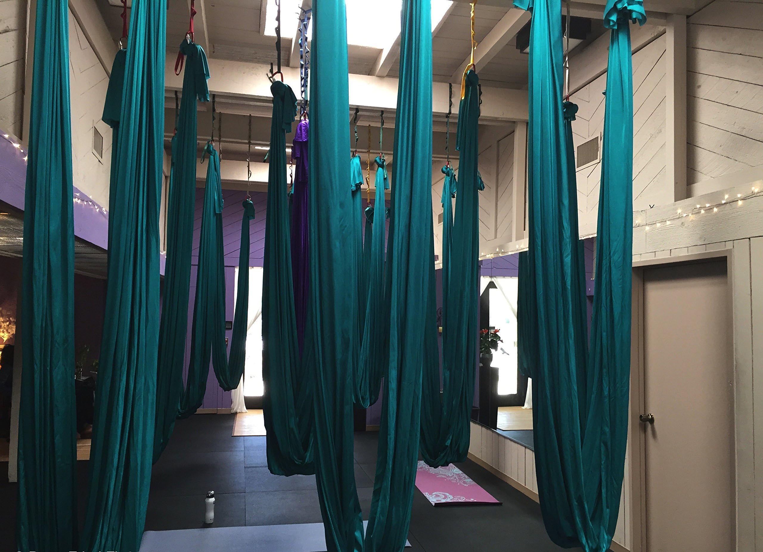 F.Life hammock in use with user inverted demonstrating supported poses