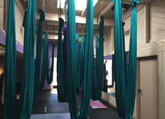 F.Life hammock in use with user inverted demonstrating supported poses