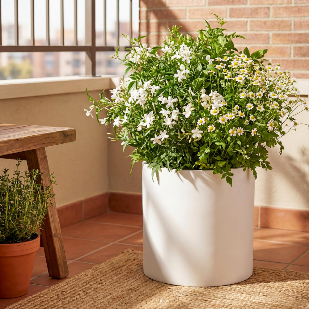 FaithLand planter beside a chair for scale demonstrating size and placement options