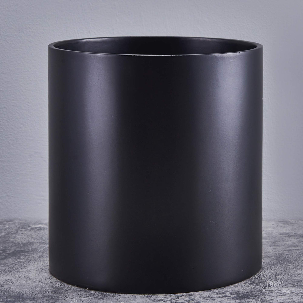 FaithLand planter front view showing matte black finish and clean cylinder shape, stylish display