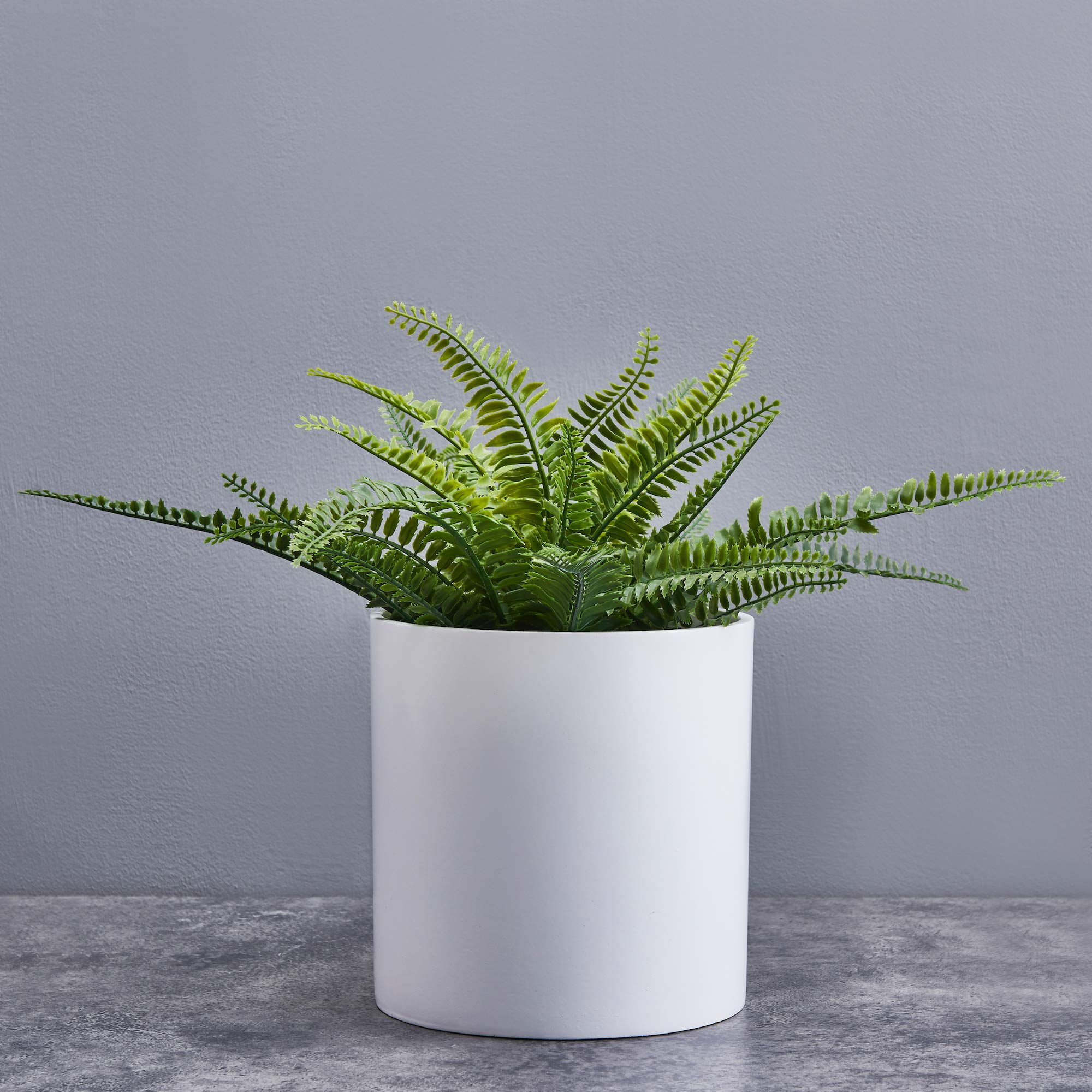 FaithLand planter on balcony with greenery demonstrating outdoor UV-resistant durability