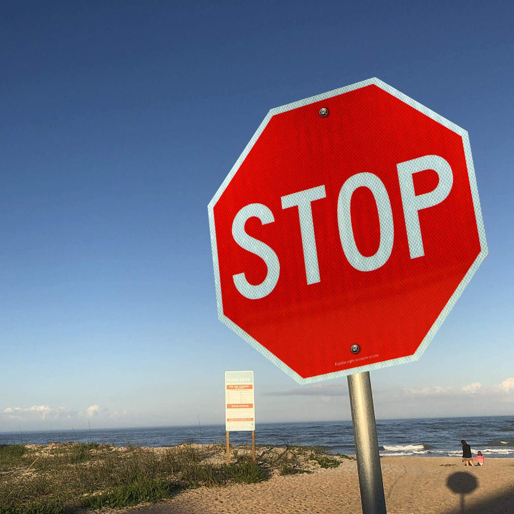 Faittoo stop sign next to ruler showing 24 x 24 inches for accurate sizing benefit