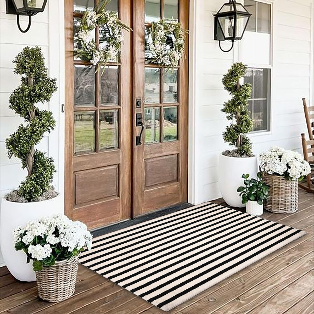 Fallovea front porch full view showing striped rug adding curb appeal