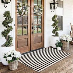 Fallovea front porch full view showing striped rug adding curb appeal