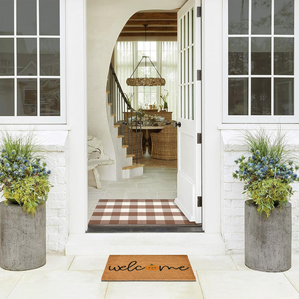 Fallovea layered entryway styled porch demonstrates coordinated seasonal decor