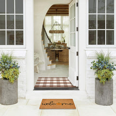 Fallovea layered entryway styled porch demonstrates coordinated seasonal decor