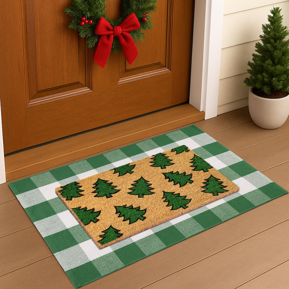 Fallovea detail of green-and-white plaid flat-weave rug, showing durable weave benefit