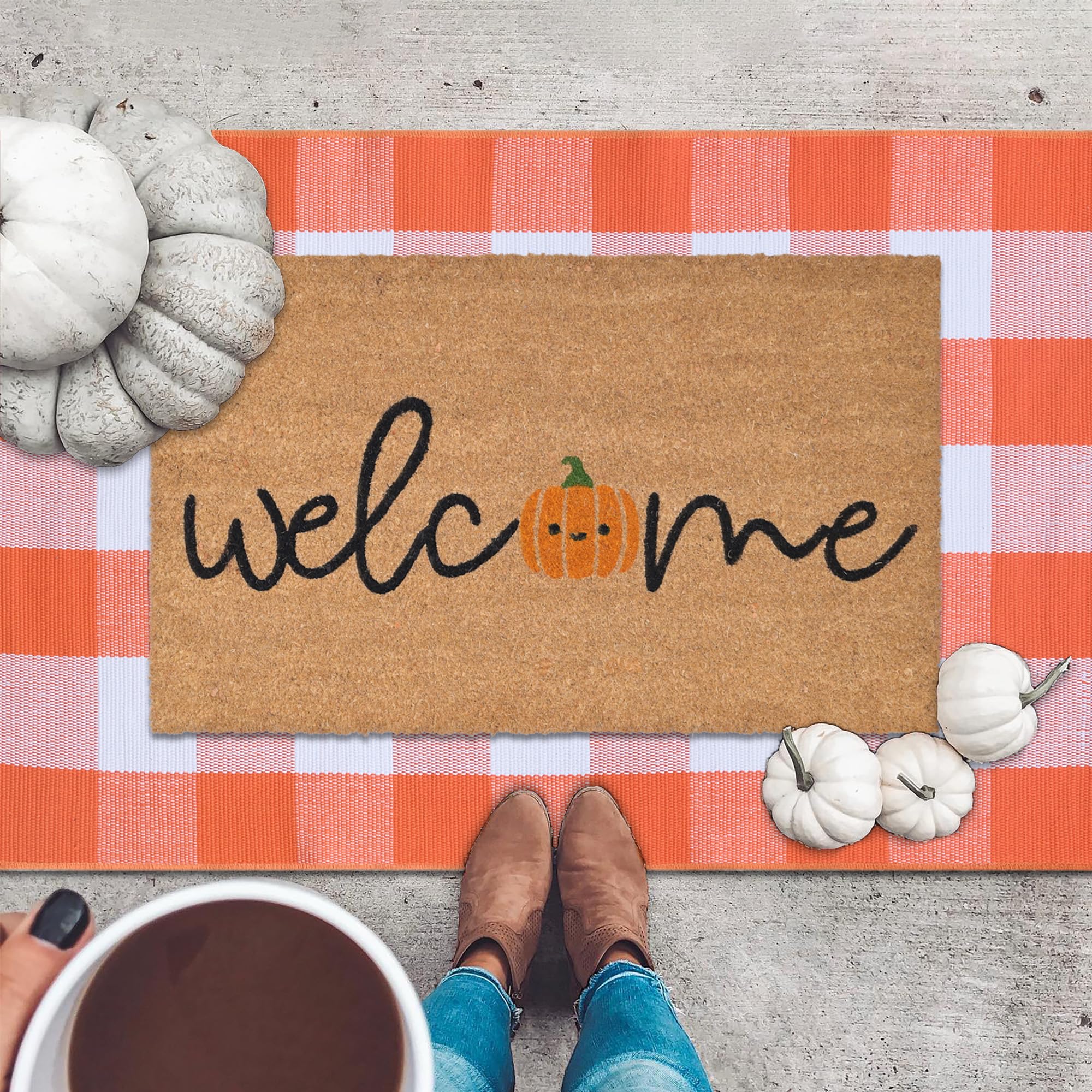 Fallovea detailed shot of orange and white plaid rug adding seasonal color