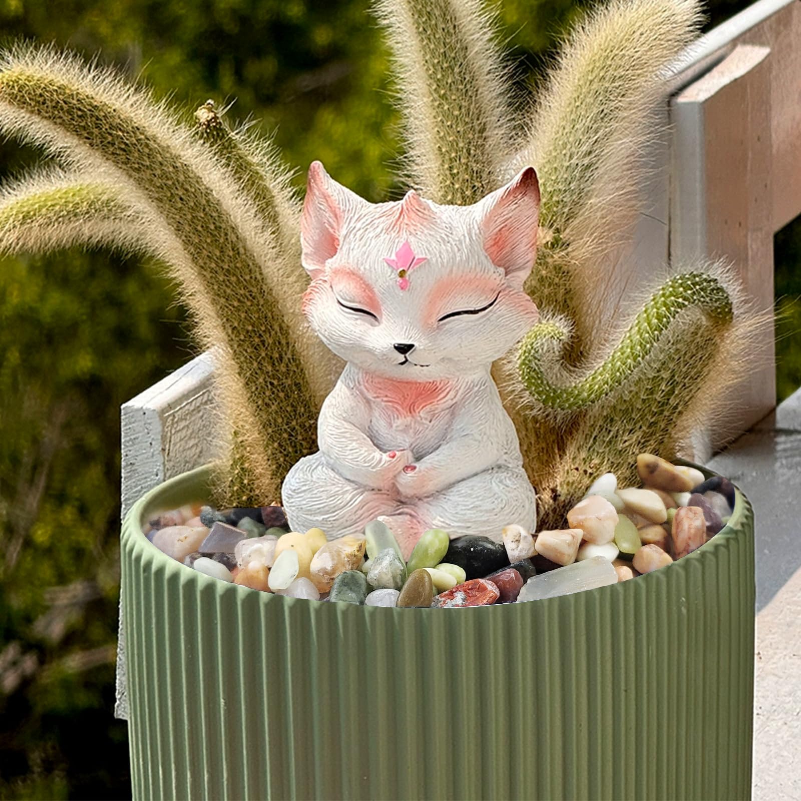 FANTIAN pebbles in vase and candle display creating a decorative focal point