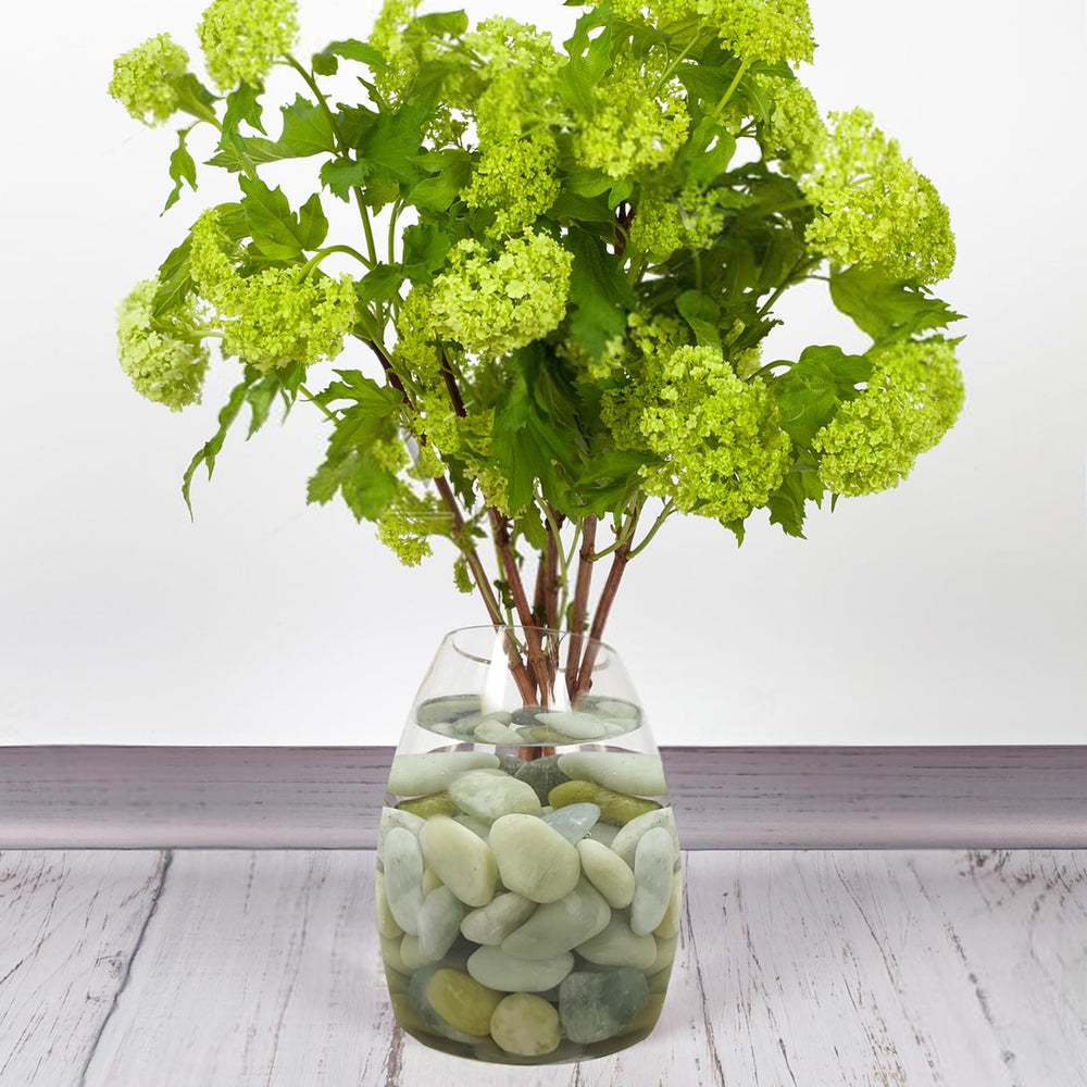 FANTIAN pebbles filling a glass vase to create an elegant centerpiece