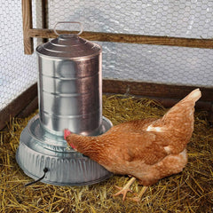 Farm Innovators base installed under metal poultry fount ensuring thawed water