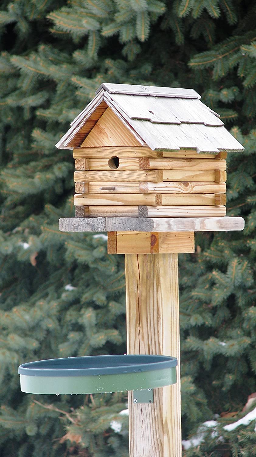 Farm Innovators birdbath installed on ground in yard showing accessibility for wild birds