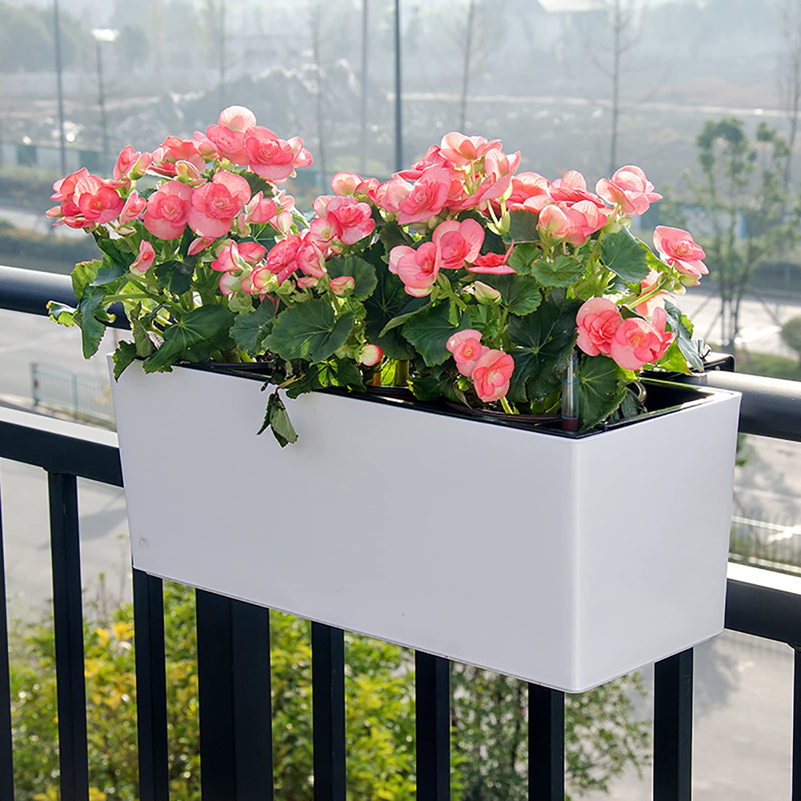 Fasmov balcony display with multiple planters creating coordinated greenery
