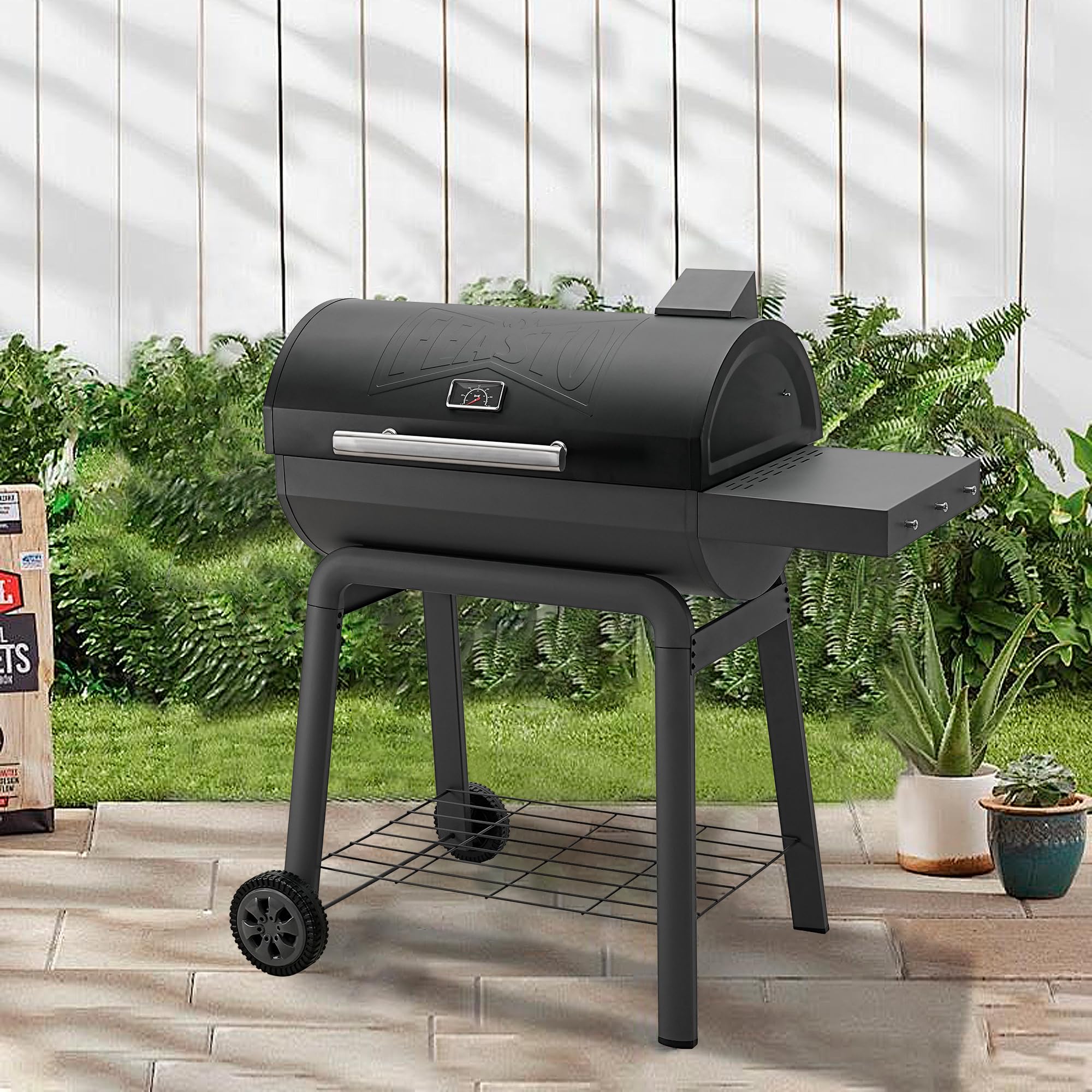 Feasto bottom shelf storing charcoal bag and accessories for convenient access