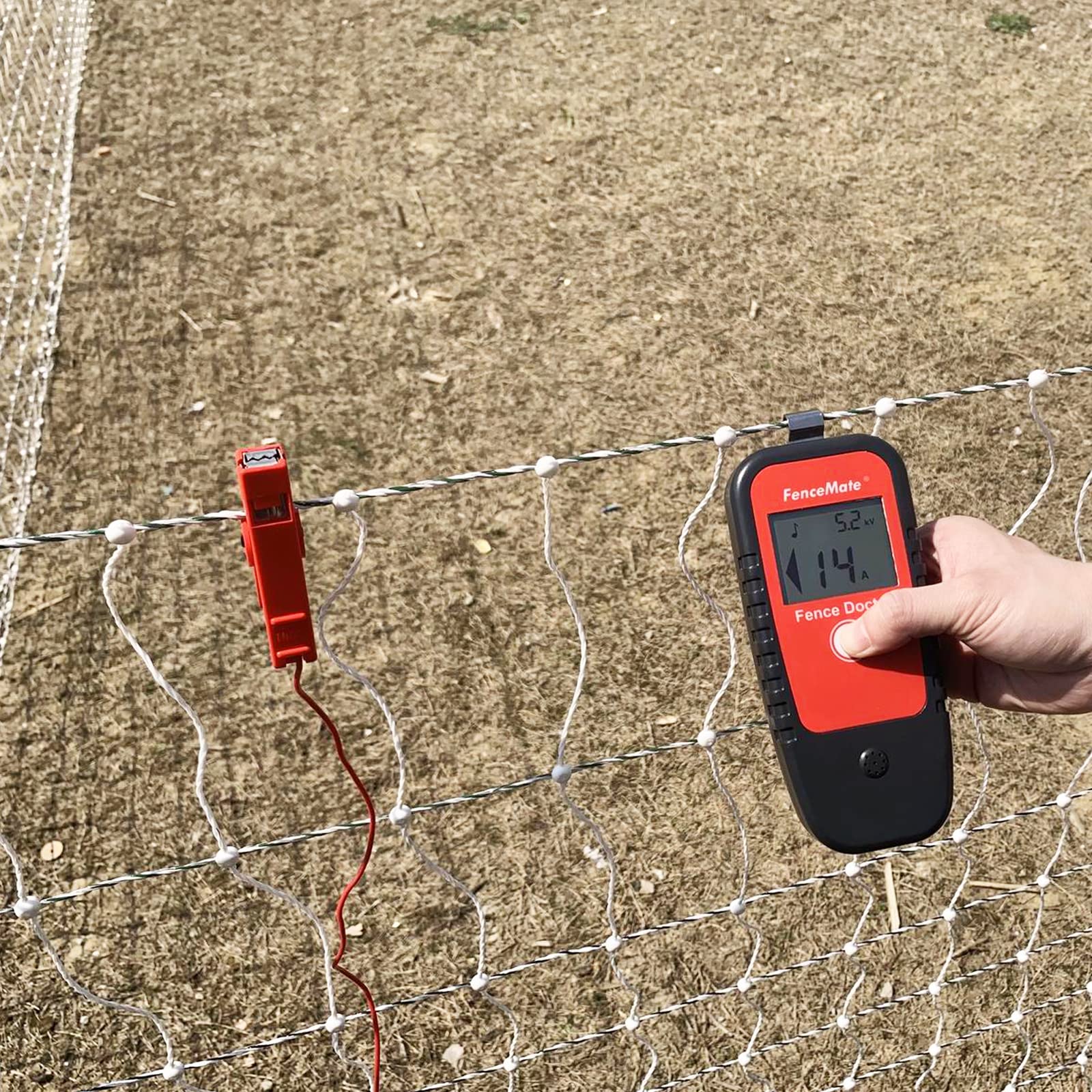 FenceMate in use on a field fence locating a fault to save troubleshooting time