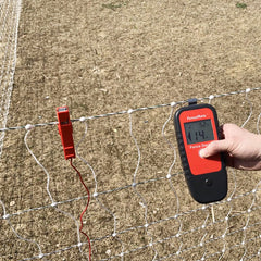 FenceMate in use on a field fence locating a fault to save troubleshooting time